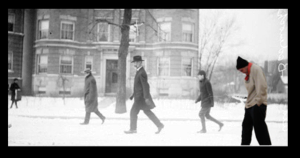  Image of Alderman Joseph Badenoch, viewed from the side, walking along a residential street covered in snow in Chicago, Illinois. Picture of Joe Gregorio super-imposed.