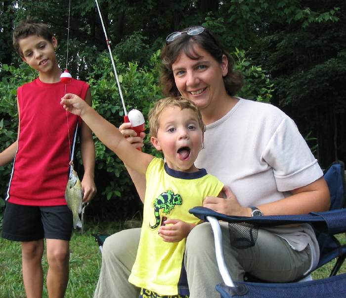 Reilly showing off his catch to Christopher and Mom.