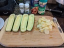 Using a knife and spoon remove the insides of the zucchini.